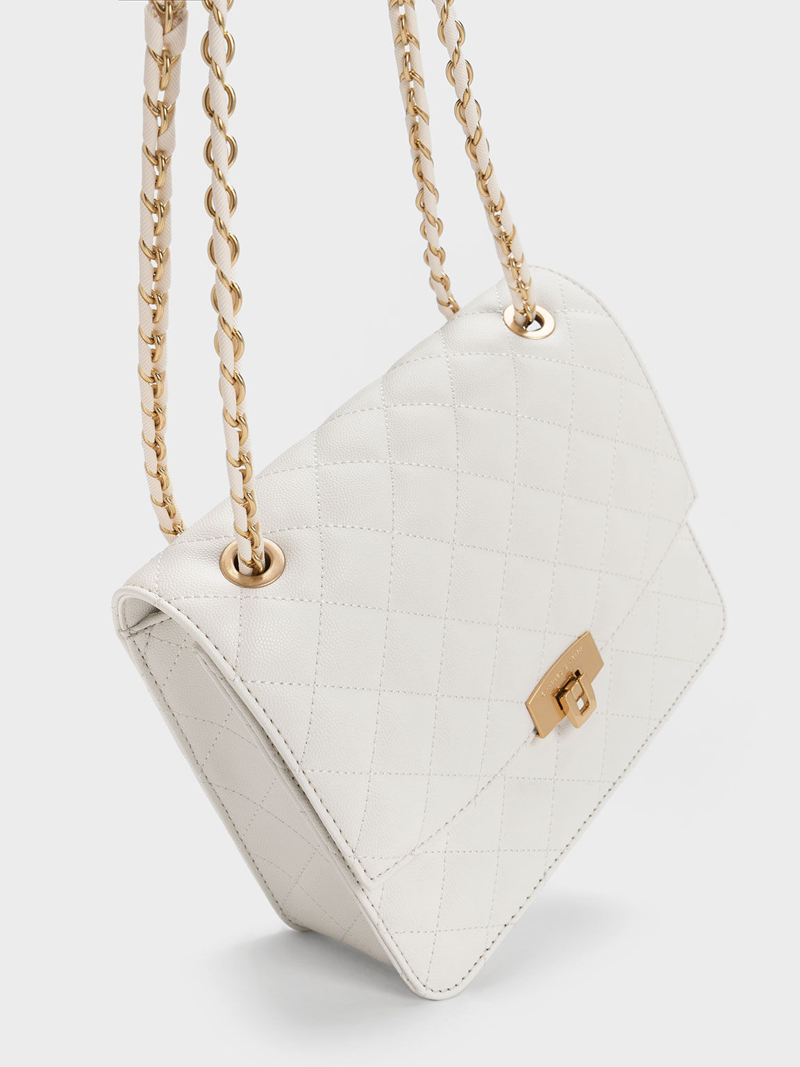 White quilted purse deals with chain strap