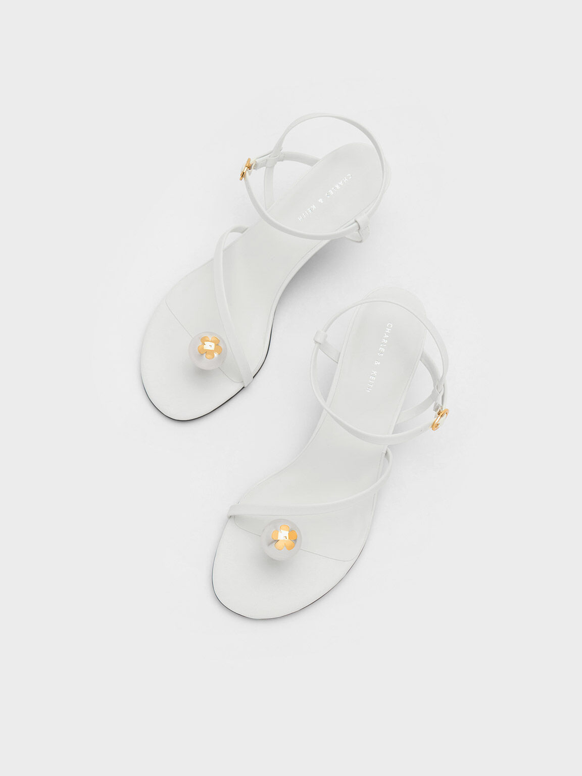 White strappy shop flip flops
