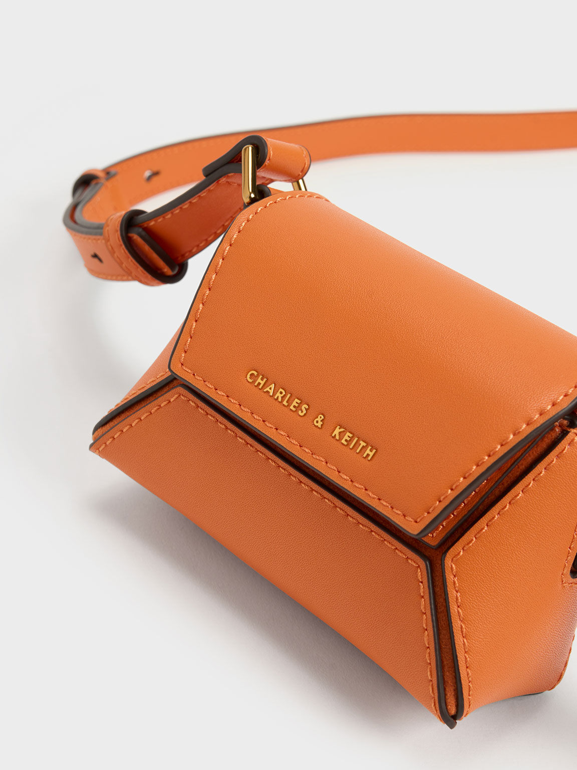 Charles and keith orange sling bag 2025