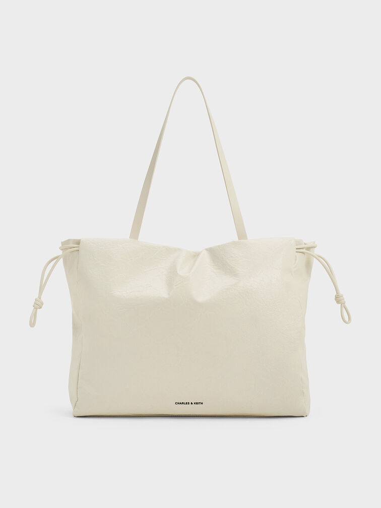 กระเป๋าโท้ทดีไซน์ลายย่นที่ปิดแบบเชือกรูดรุ่น Bethel, สีครีม, hi-res