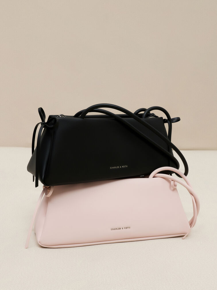 กระเป๋าสะพายไหล่ทรงสี่เหลี่ยมคางหมูแบบยาวตกแต่งด้วยโบว์รุ่น Hazel, สีซอฟต์พิงค์, hi-res