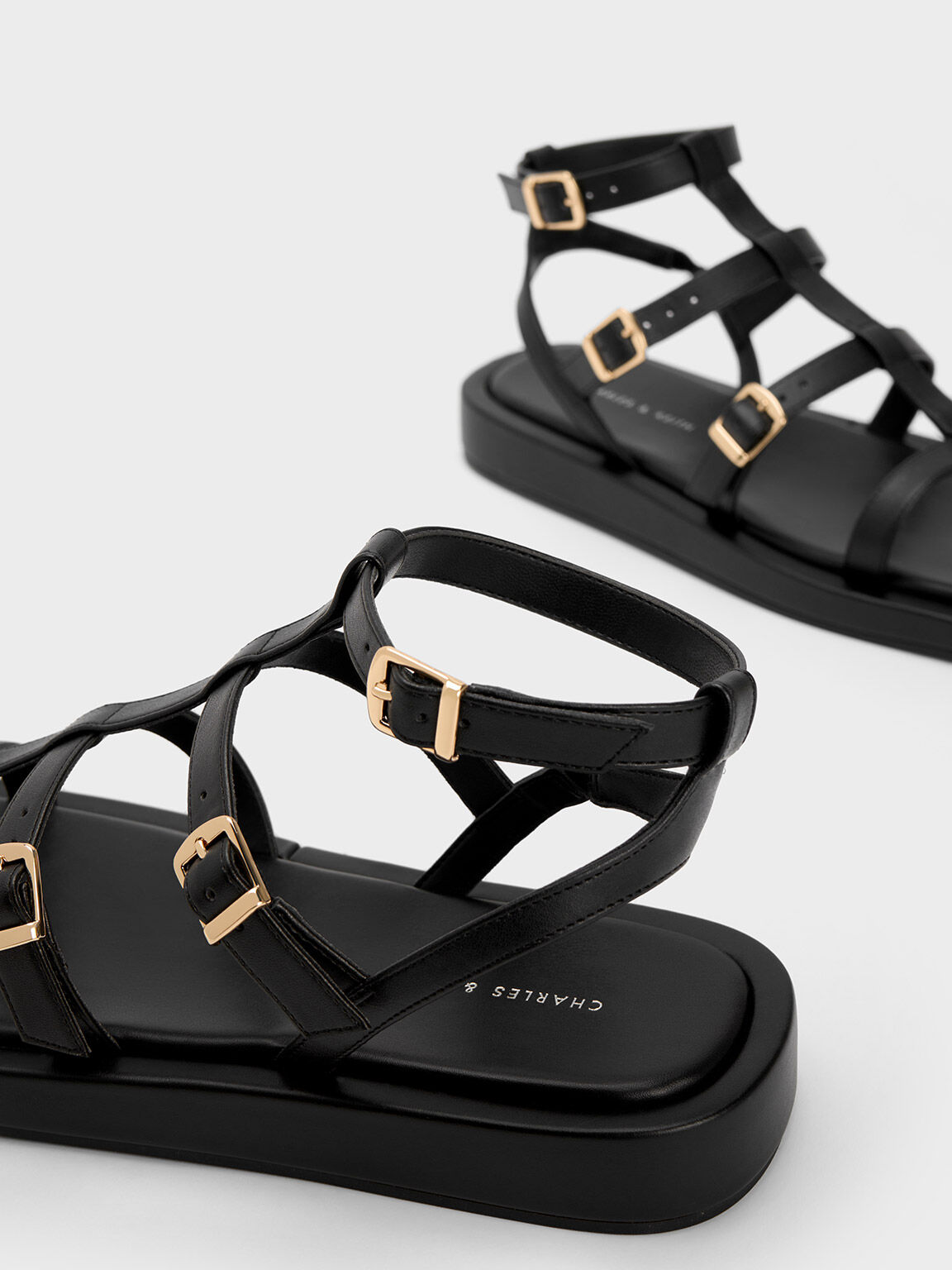 Black and gold gladiator sandals outlet