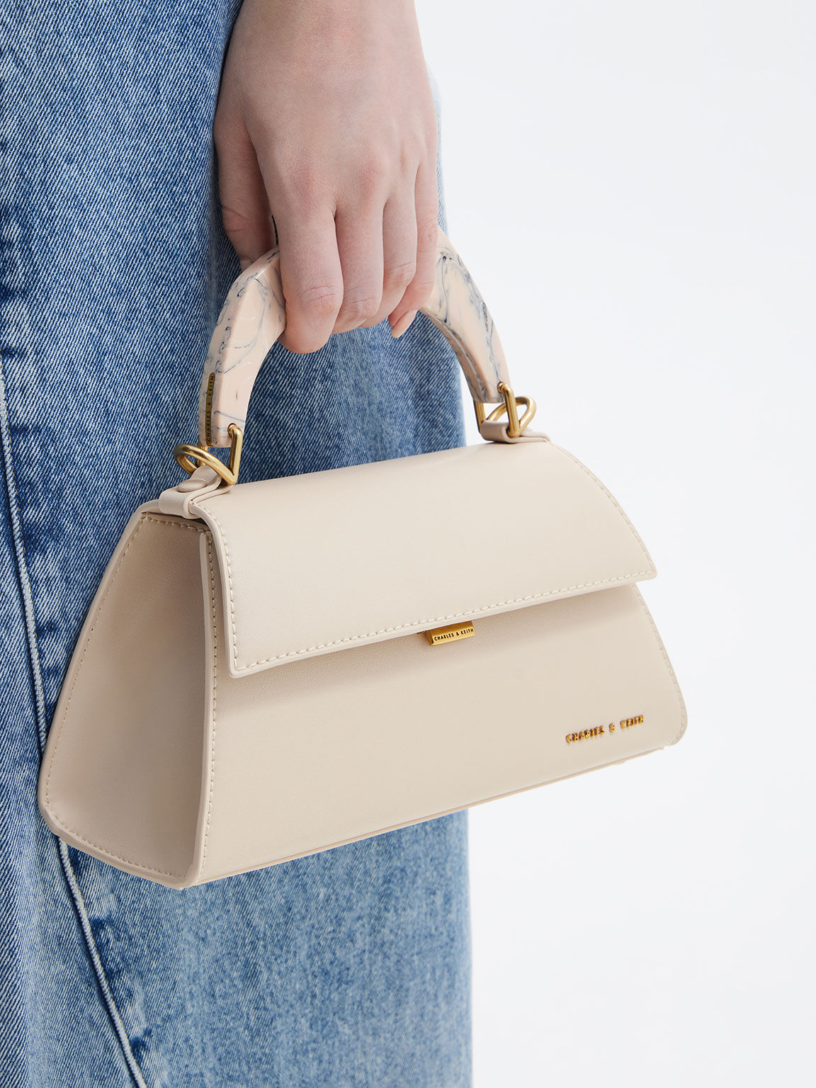 Top handle trapeze bag store