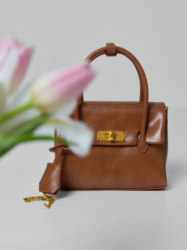 กระเป๋าโท้ทมินิดีเทลตัวล็อคแบบหมุนรุ่น Kerry, สีดิสเทรสด์แทน, hi-res