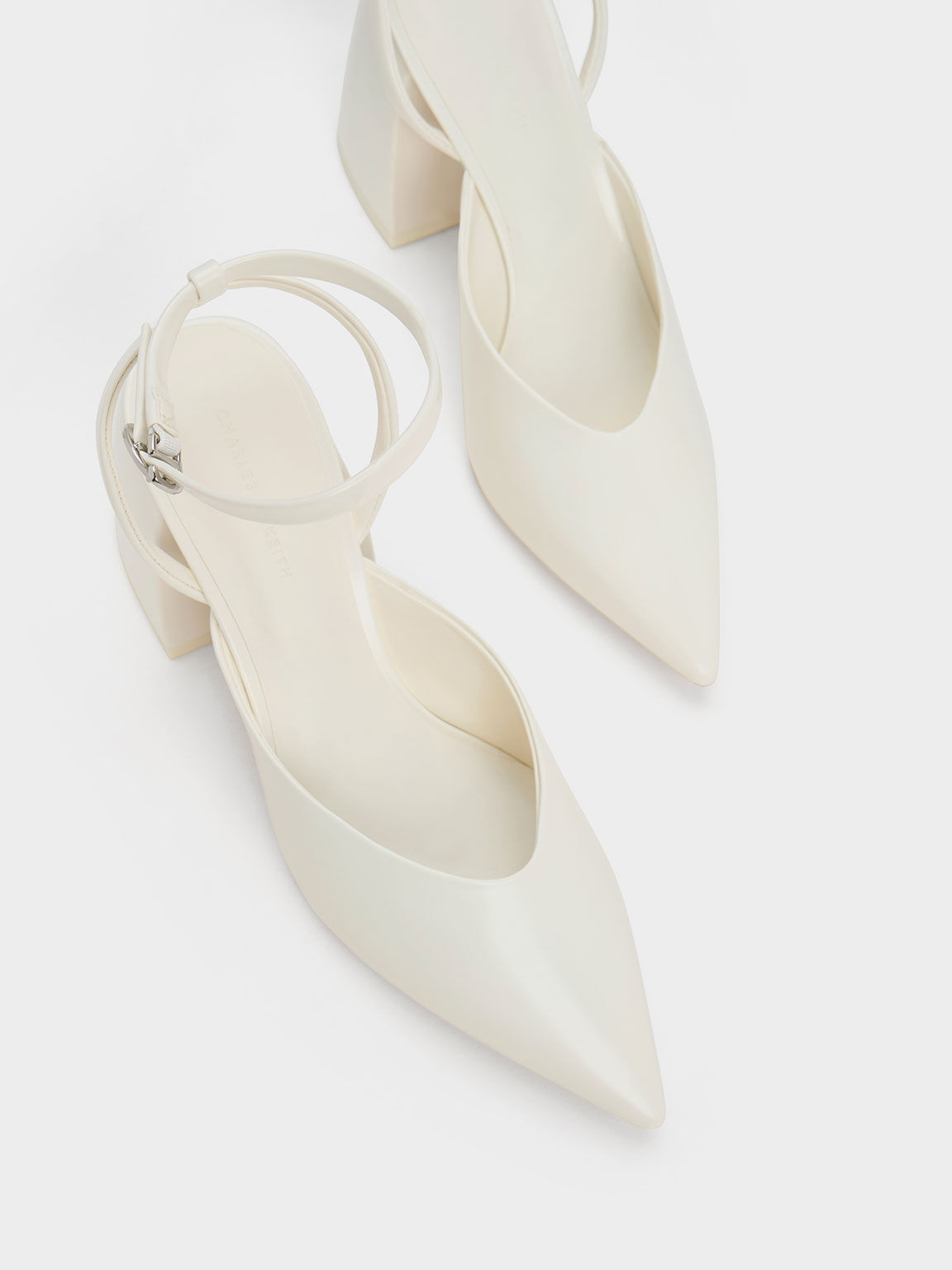 Chunky white store pumps