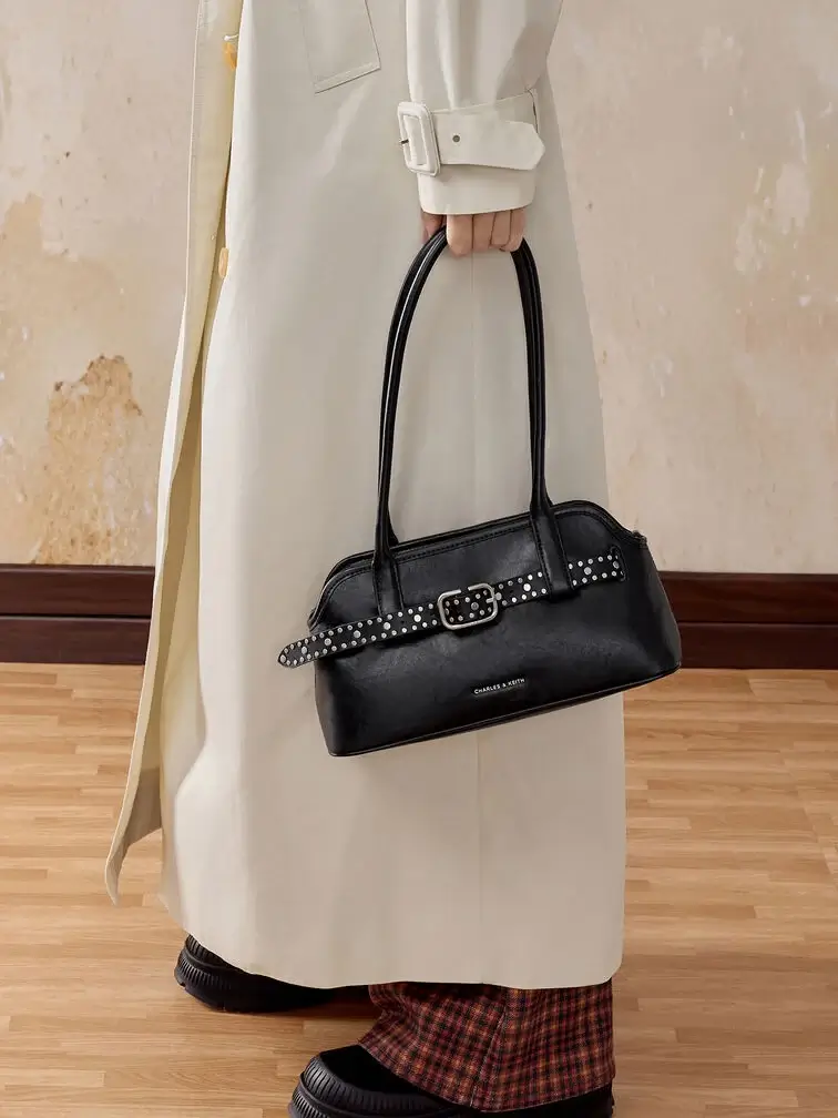 Black Victoria East-West bag with a studded belt detail, perfect for the cool edgy girls.