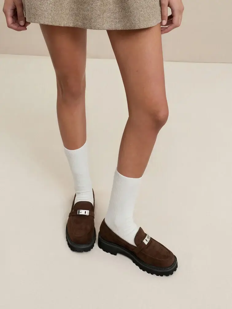 Dark brown penny loafers, a refined option for everyday wear.
