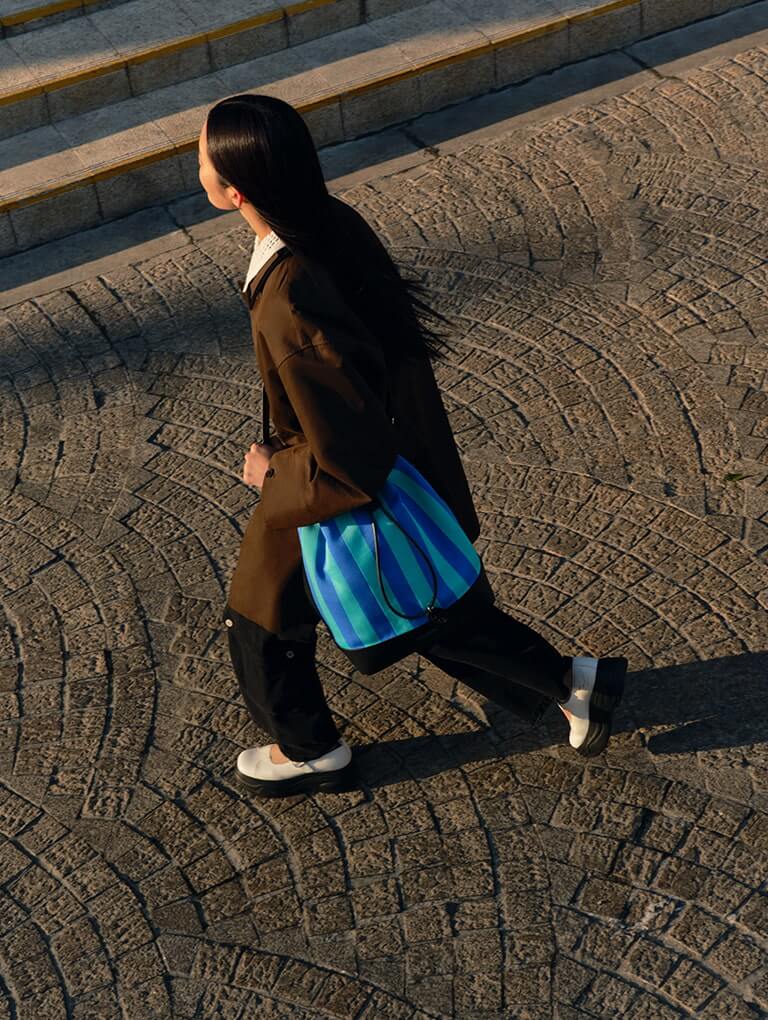 Women’s curved platform Mary Janes and large striped bucket bag  from the Short Sentence x CHARLES & KEITH collection - CHARLES & KEITH