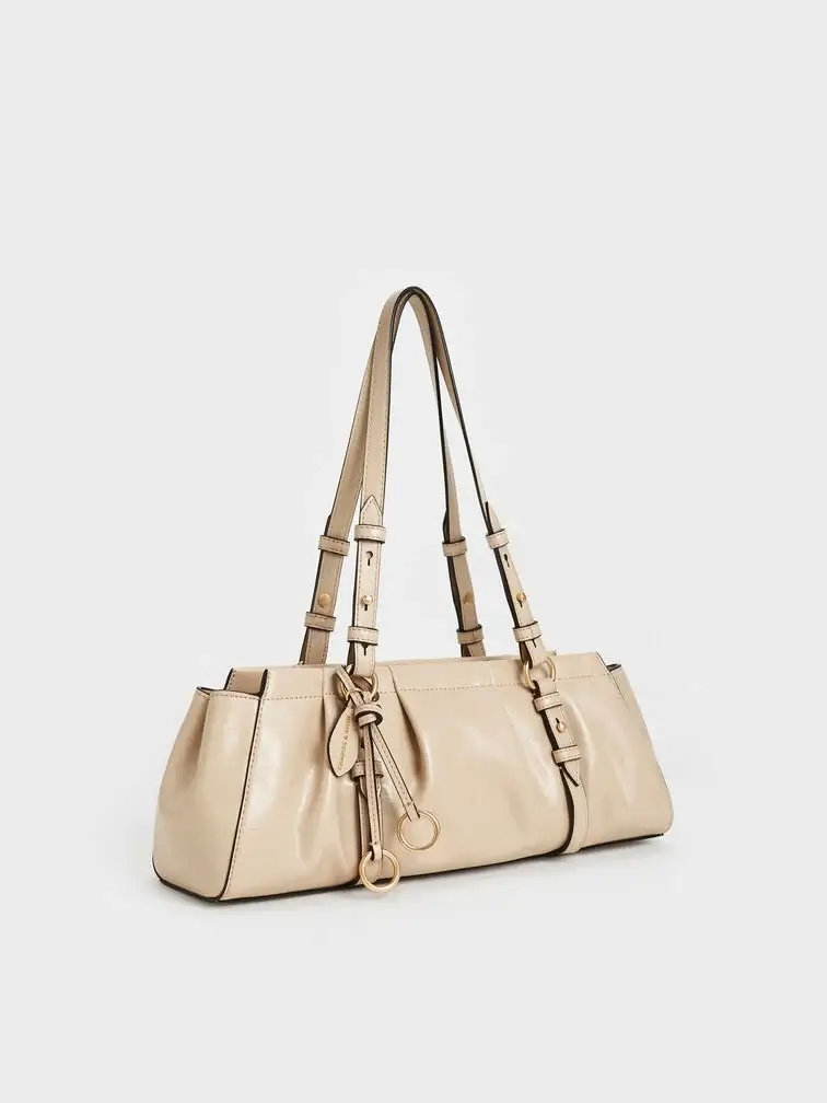 Britton ruched East-West bag in Oat. 
