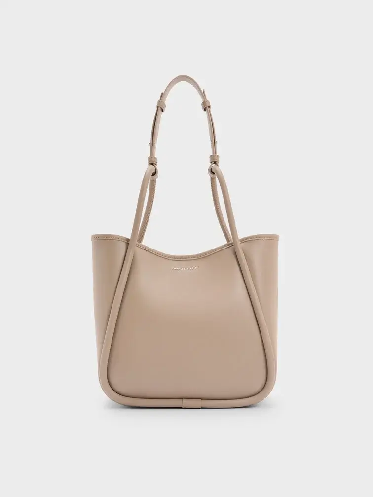 The mini Lyla tote with its opening unclipped.