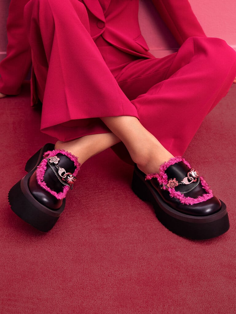 Women’s Lotso Embellished Platform Mules and Lotso Furry Knee-High Combat Boots, both in black- CHARLES & KEITH