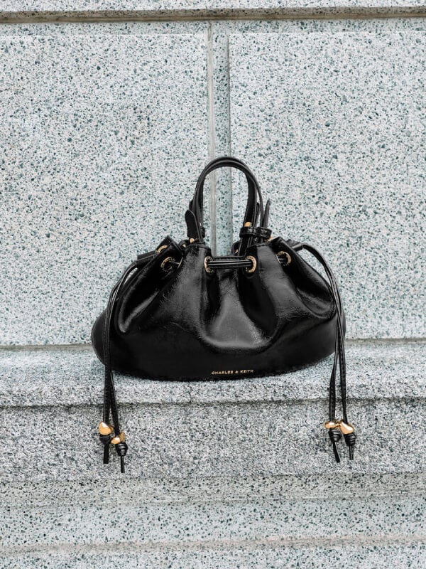 Women’s mini Moxie drawstring bucket bag in black - CHARLES & KEITH