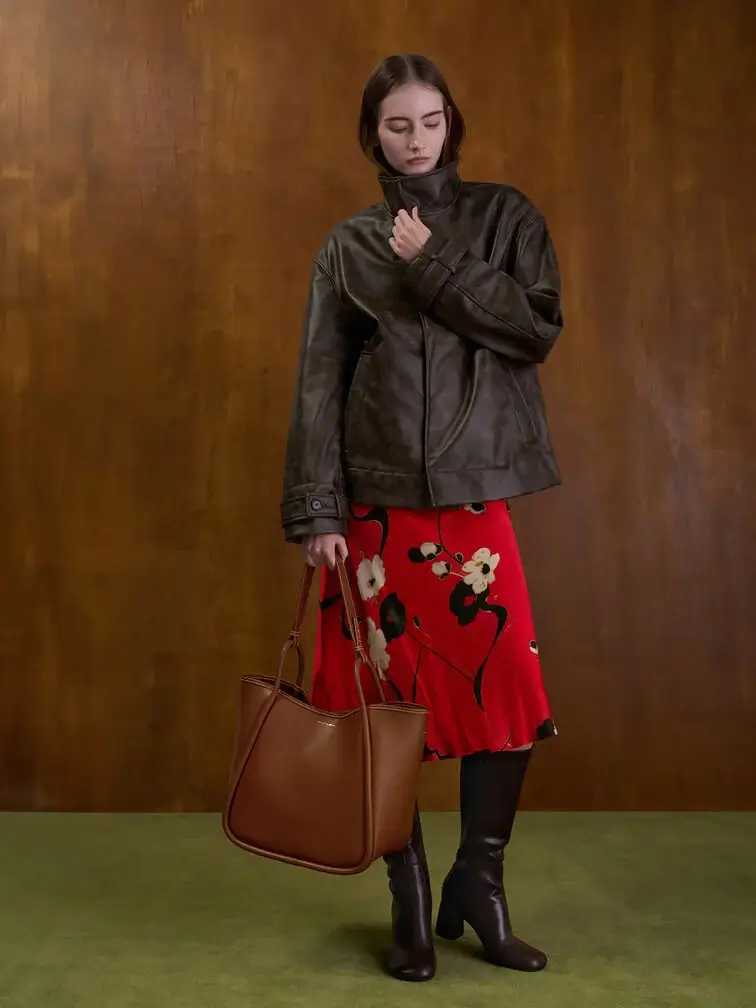 The Lyla tote paired with a leather jacket, skirt and knee-high boots.