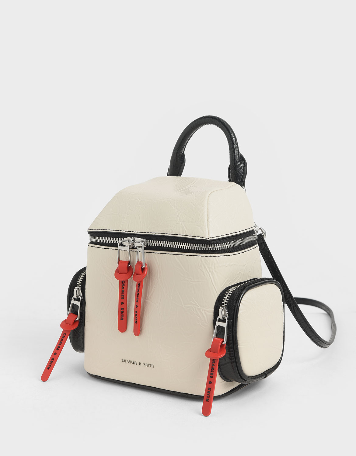Women’s cream wrinkled effect two-way zip backpack – CHARLES & KEITH