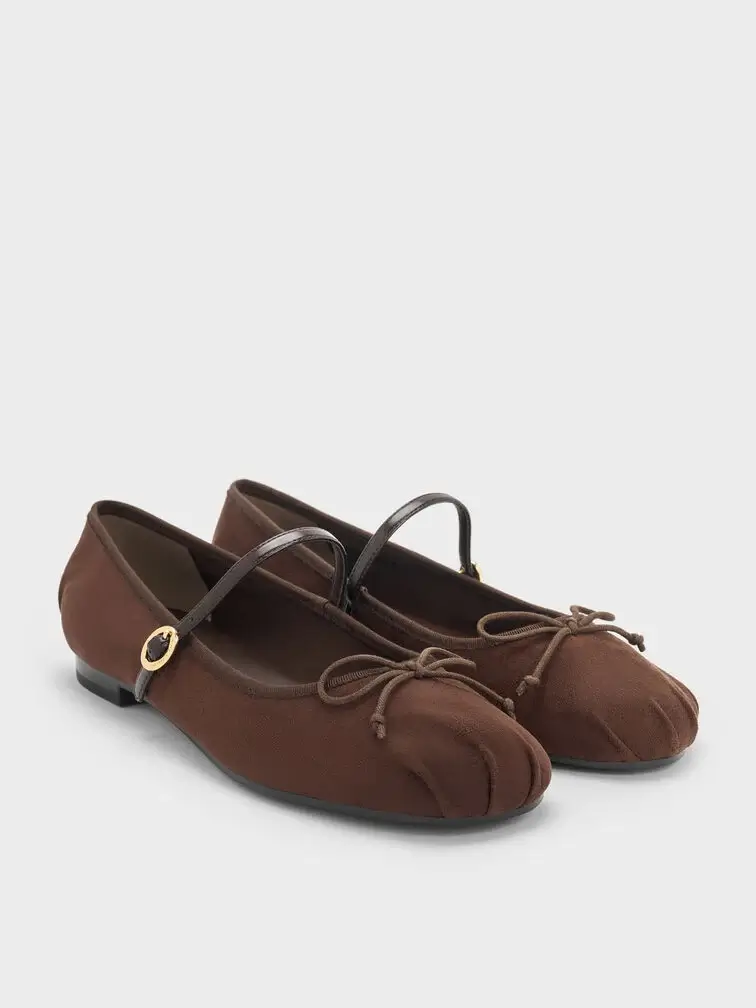 Dark brown faux suede Mary Janes, a thoughtful gifting choice.