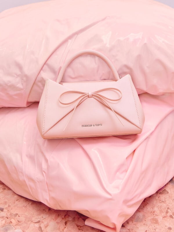 Women’s Hazel bow panelled top handle bag in soft pink - CHARLES & KEITH