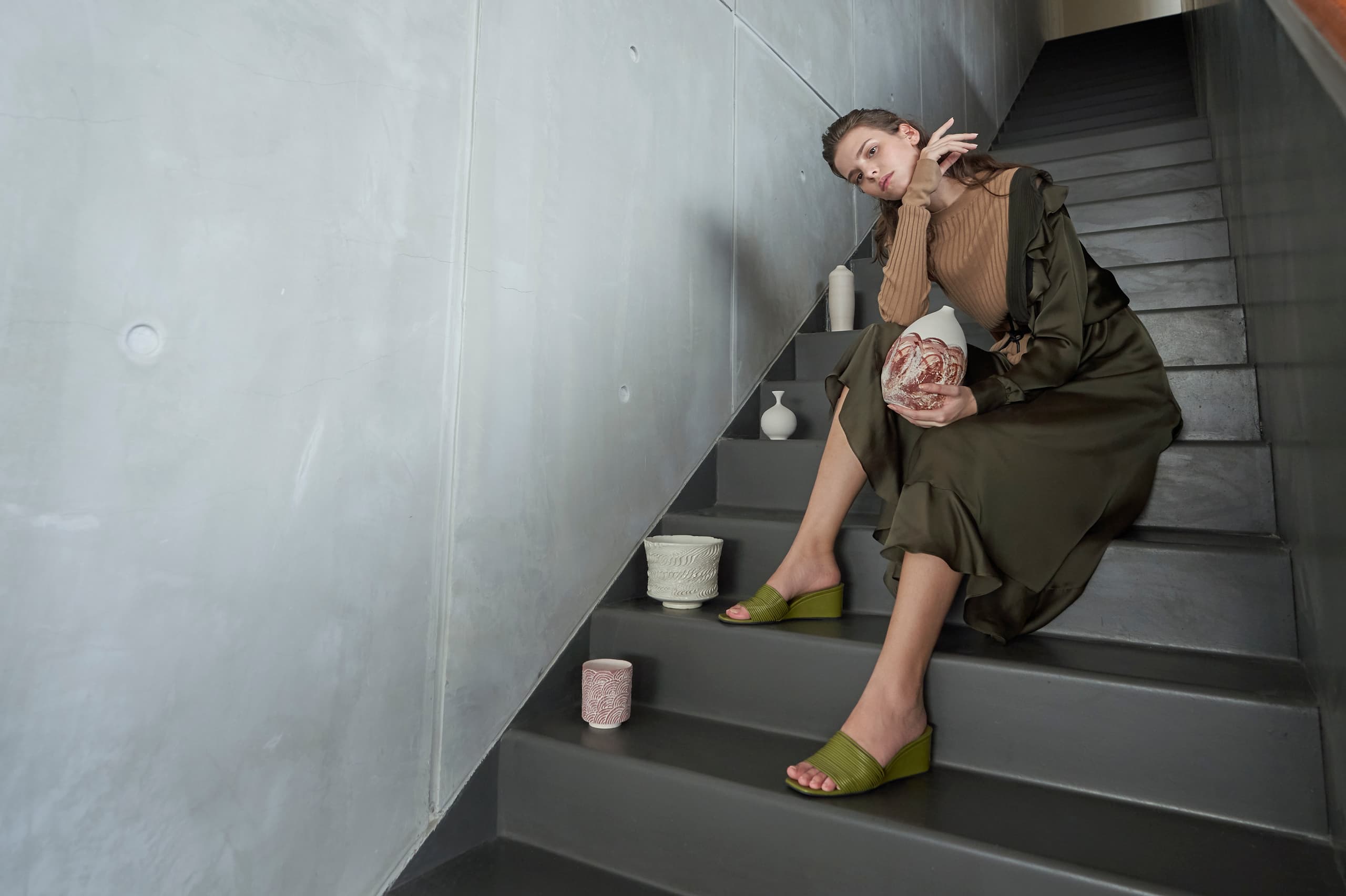 Women’s strappy wedges in green (sitting pose) – CHARLES & KEITH