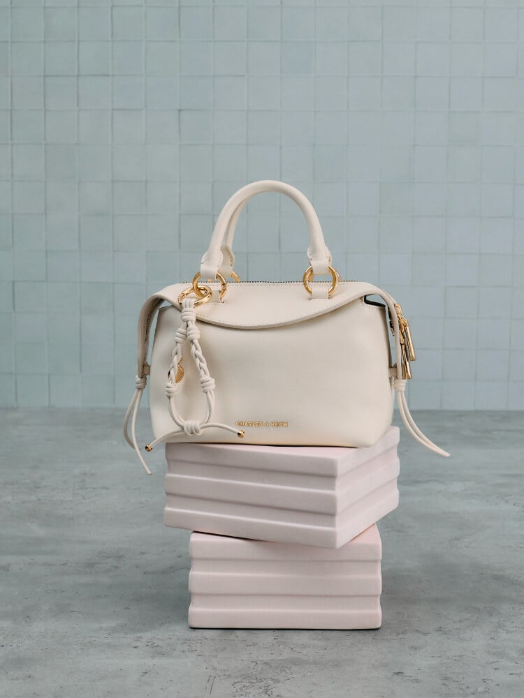 Women’s Haylen braided-charm bowling bag in cream - CHARLES & KEITH
