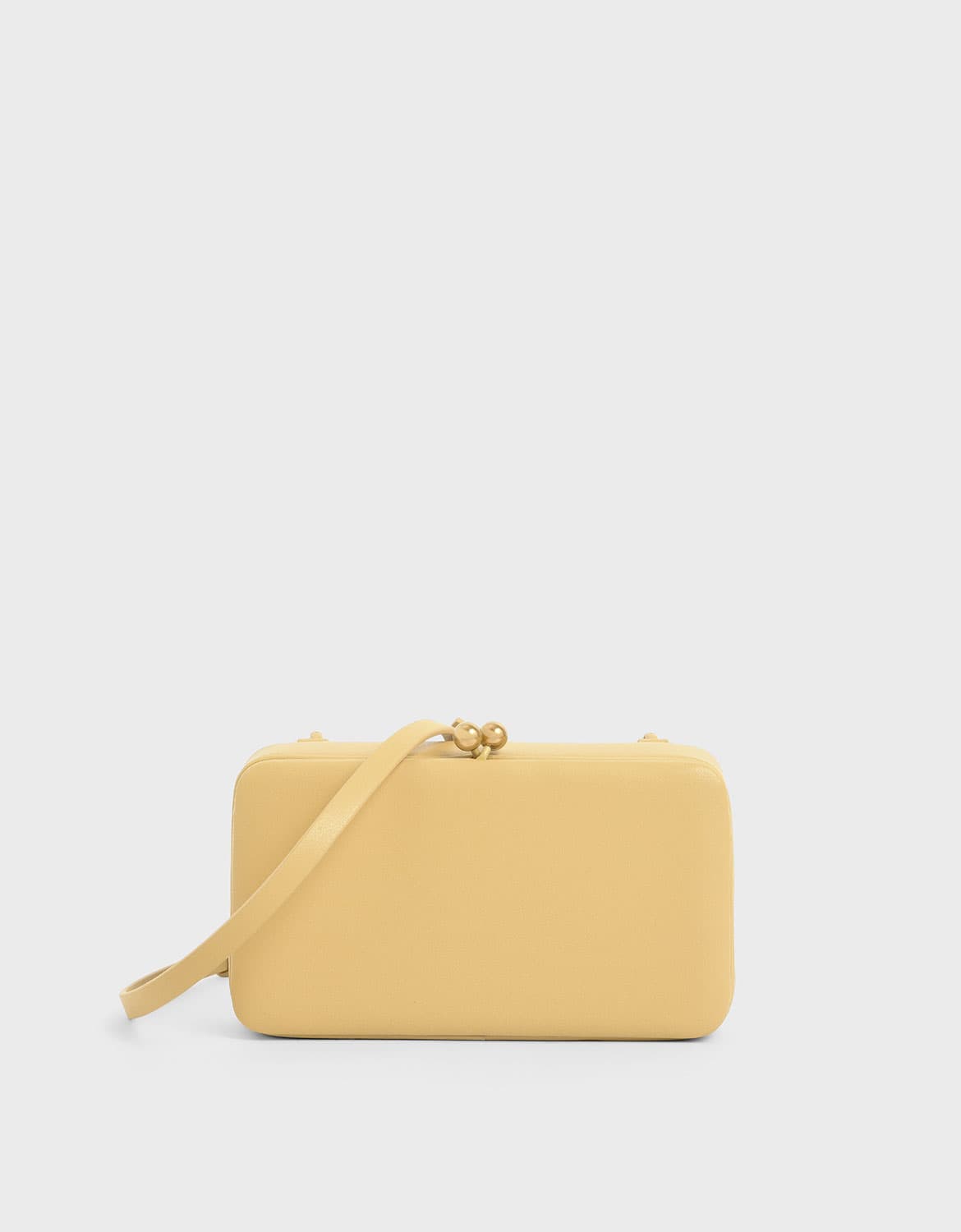 Women’s boxy twist lock crossbody bag in yellow – CHARLES & KEITH