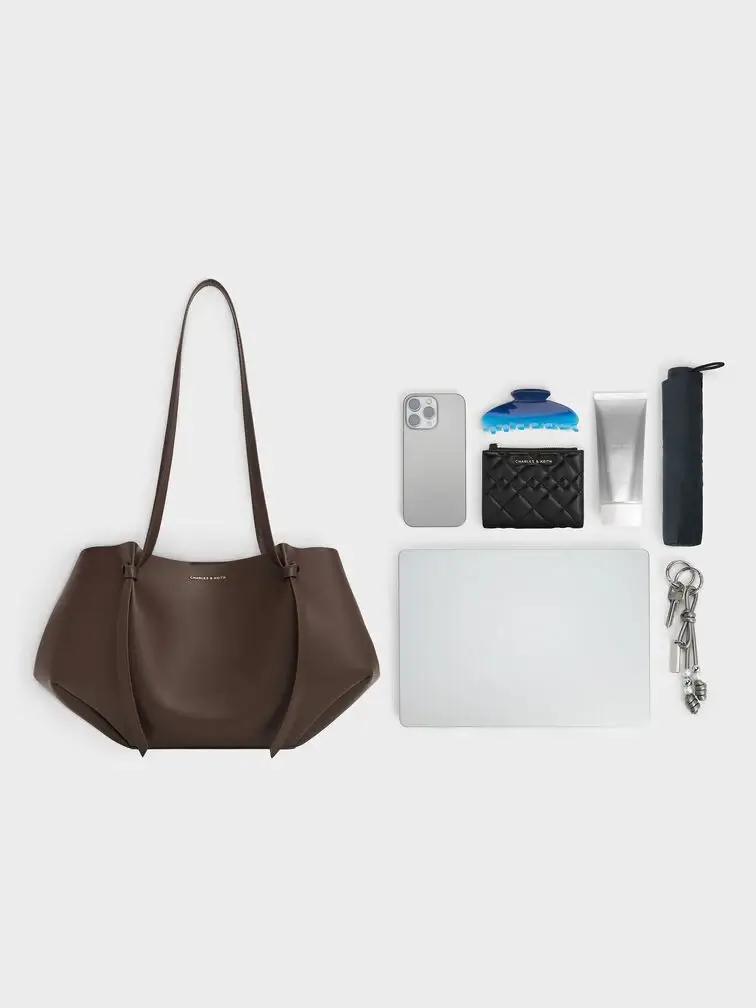  The regular Calla tote bag with the side flaps folded in can comfortably fit an 11” ipad, phone, umbrella and other daily essentials 