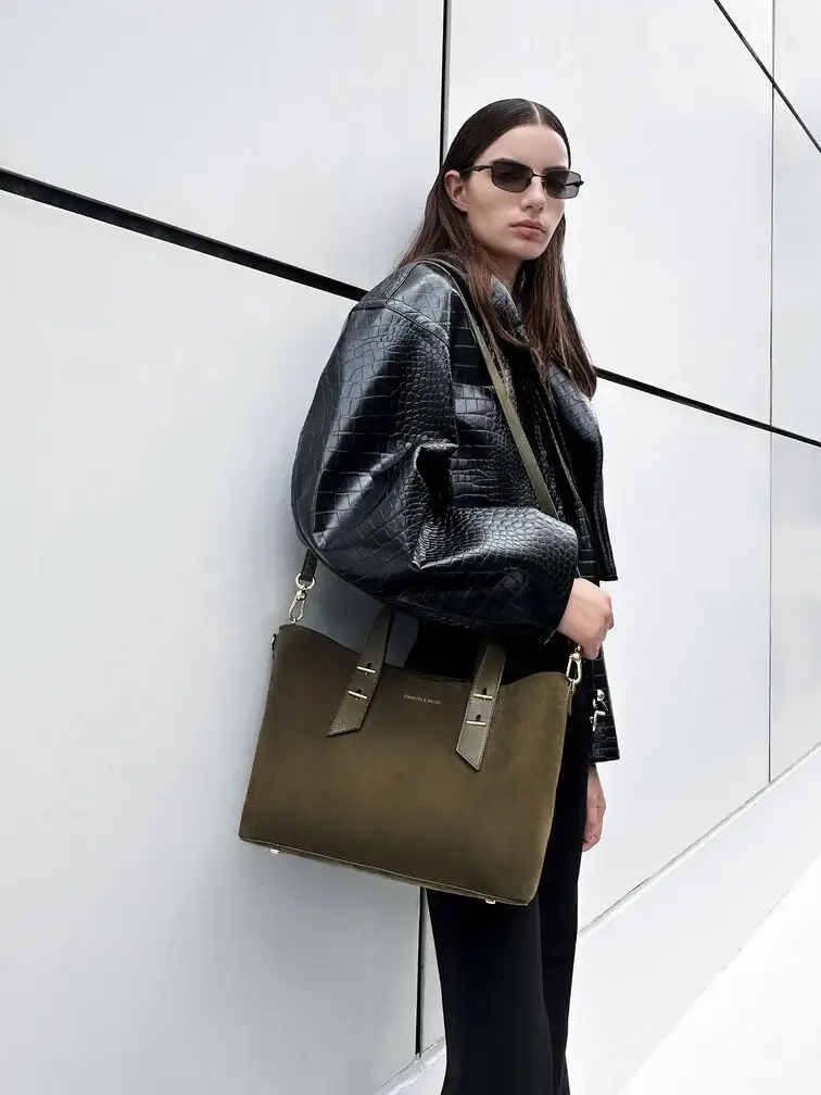 Tote bag offering multiple carrying options with a detachable shoulder strap.