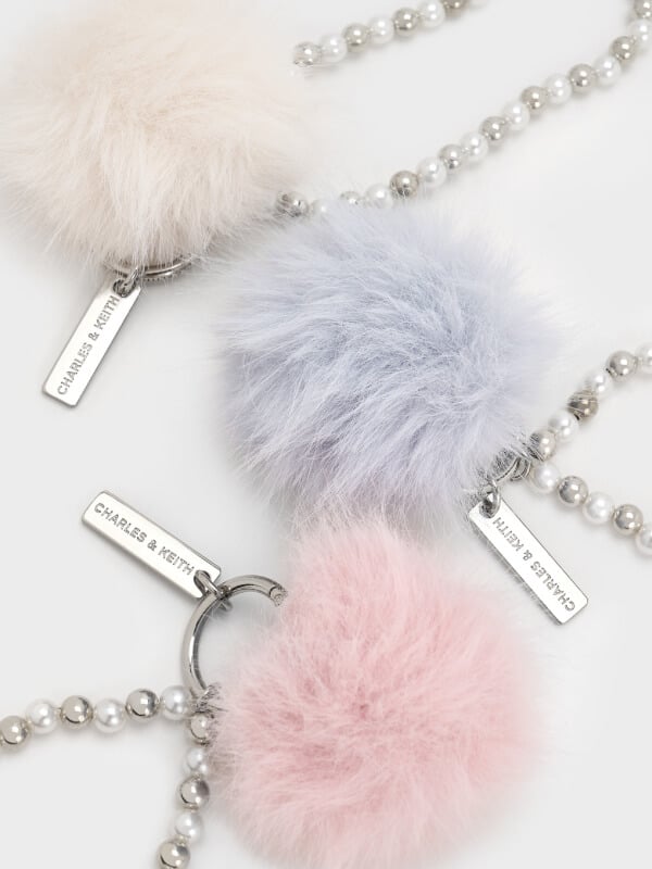 Women’s pearl beaded-strap furry ball charm in cream, cotton candy pink and sea salt blue – CHARLES & KEITH
