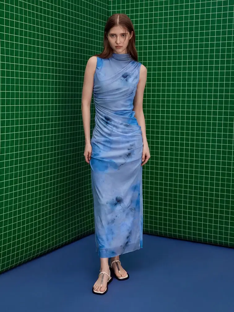 Blue printed dress styled with thong sandals. 