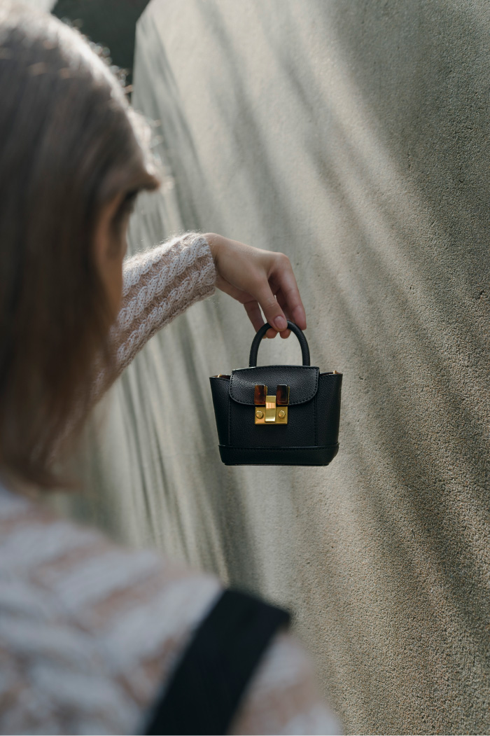 Women’s stone-embellished pouch bag in black – CHARLES & KEITH