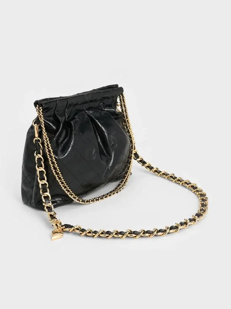 Black quilted hobo bag, perfect for the fuss-free, effortlessly stylish mum.