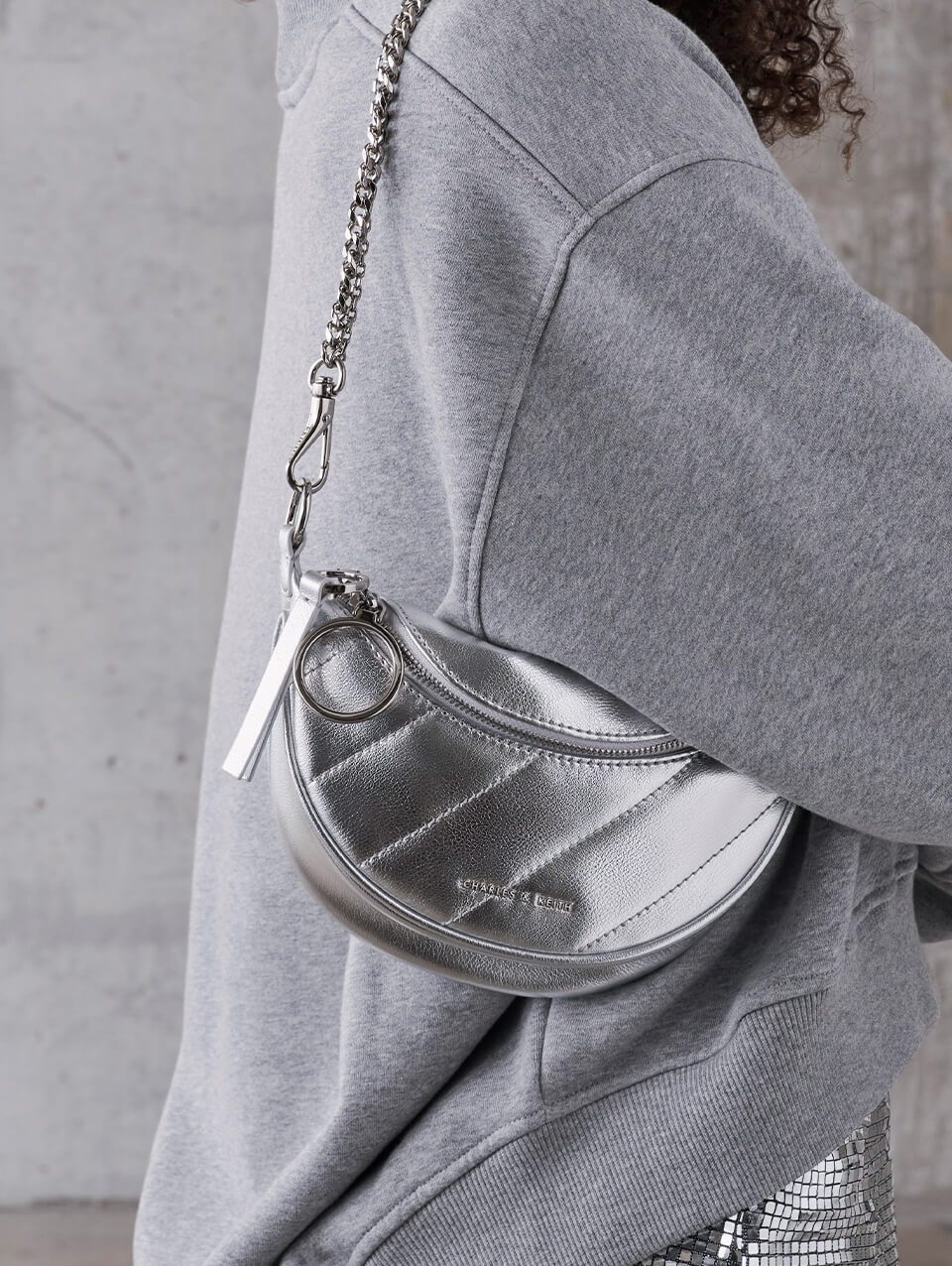 Women’s Philomena Crinkle-Effect Half-Moon Crossbody Bag; Charlot Metallic Chain Strap Bag; Philomena Crinkle-Effect Half-Moon Crossbody Bag; Avis Metallic Belted Ruched Shoulder Bag; Olivia Metallic Trapeze Shoulder Bag, all in silver - CHARLES & KEITH